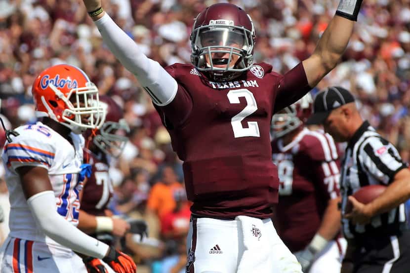 Texas A&M quarterback Johnny Manziel (2) is all smiles after his second-quarter touchdown...