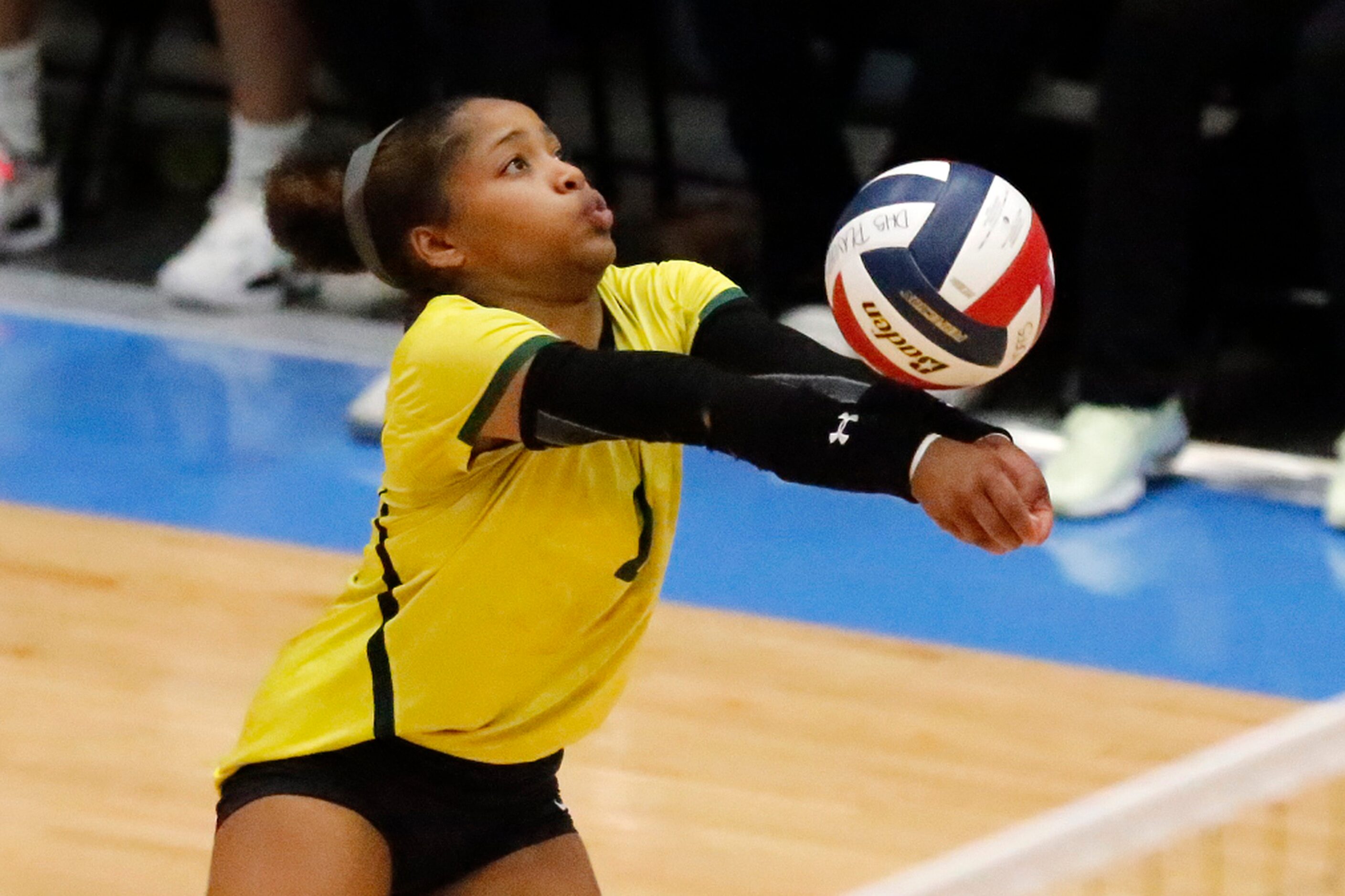 DeSoto High School libero Miya Benson (2) receives a serve during game two as DeSoto High...