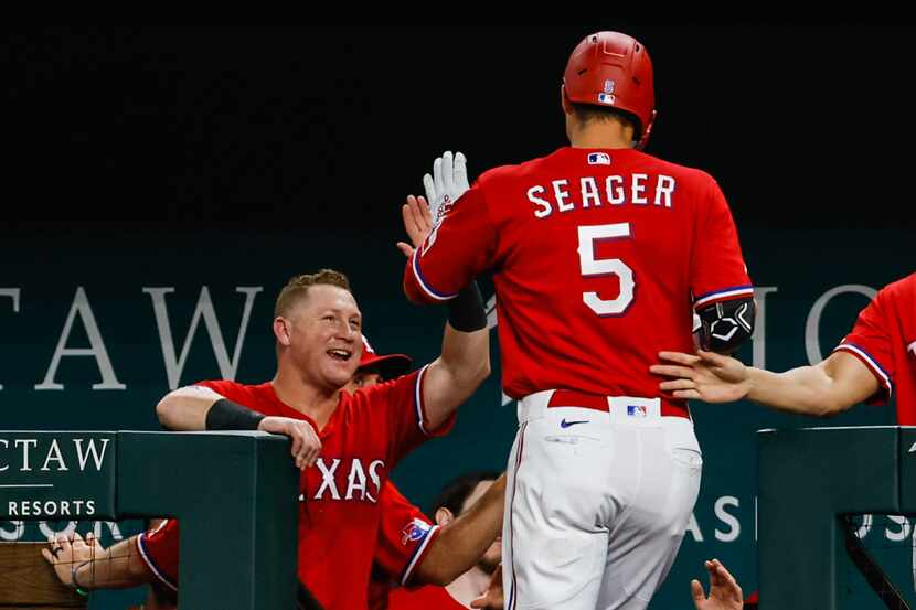 Texas Rangers shortstop Corey Seager (5) celebrates his homer against the Minnesota Twins...