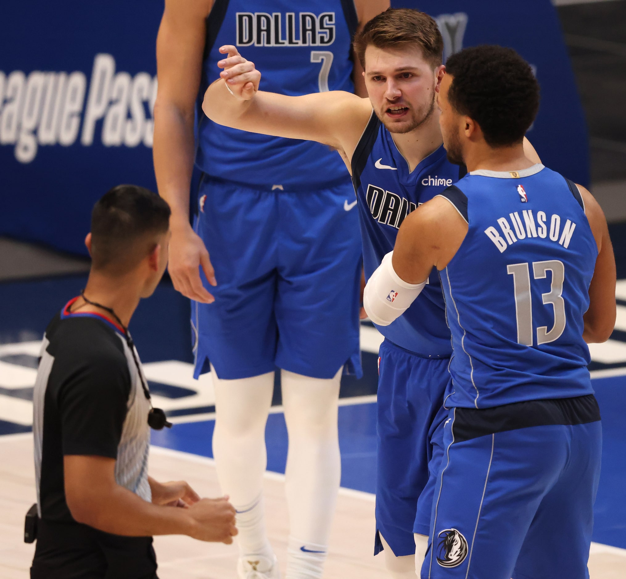 Dallas Mavericks guard Luka Doncic (77) questions a call from referee Suyash Mehta (82) as...