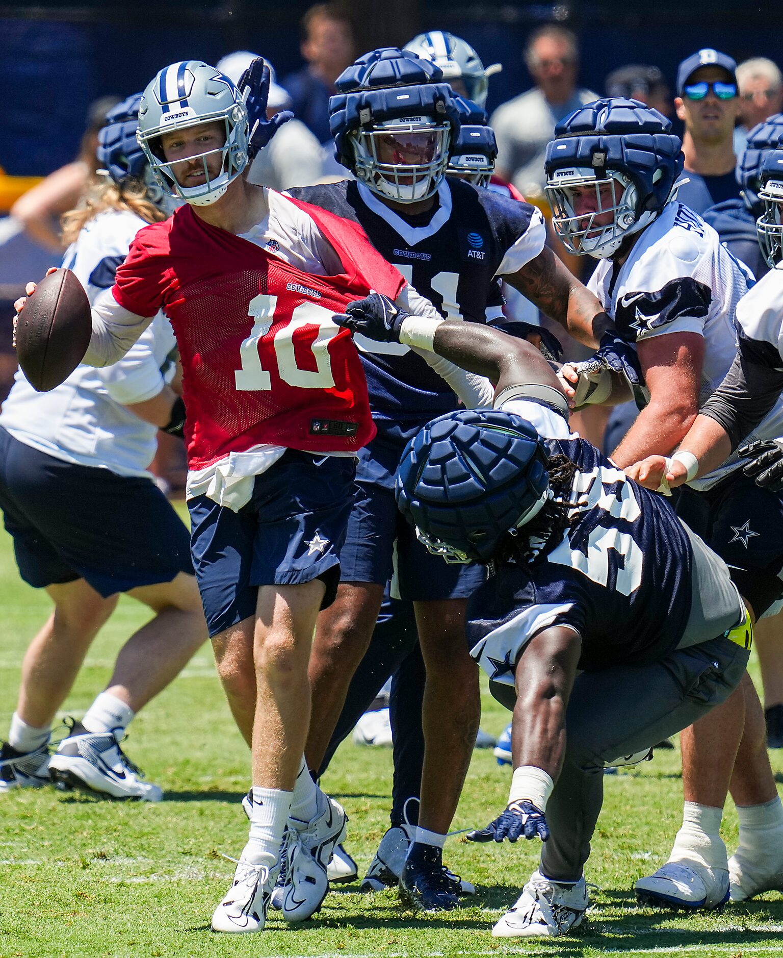 Dallas Cowboys quarterback Cooper Rush (10) has his jersey pulled by defensive tackle Mazi...