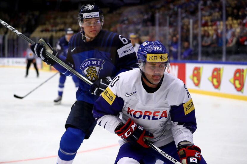 HERNING, DENMARK - MAY 05: Julius Honka (L) of Finland and Michael Swift of Korea battle for...