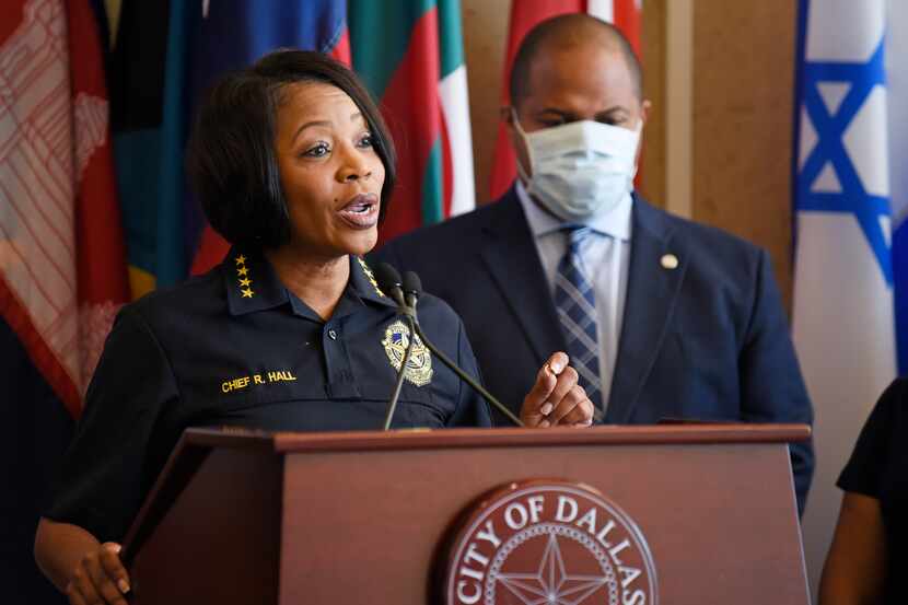 Dallas Chief of Police Renee Hall, left, and Dallas Mayor Eric Johnson, right, conduct a...