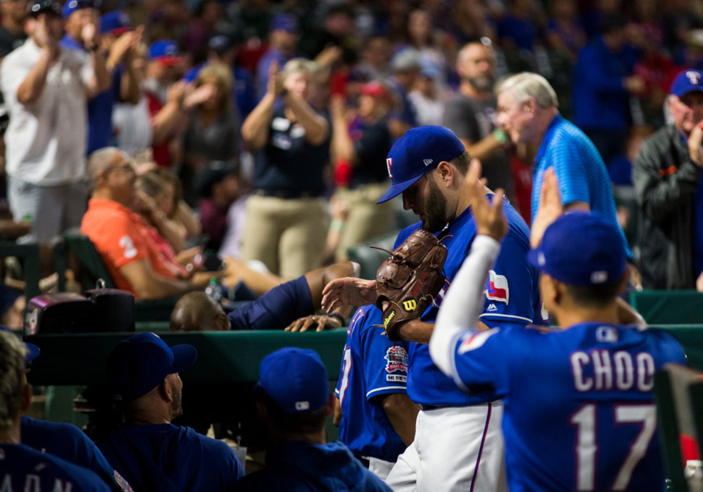 Texas Rangers starting pitcher Lance Lynn (35) returns to the dugout after the seventh...