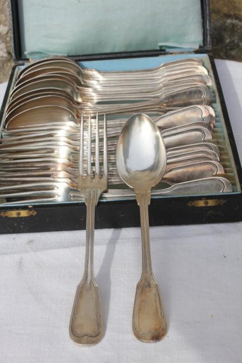 
Vintage set of 1920s French spoons and forks in a box lined with blue silk 
