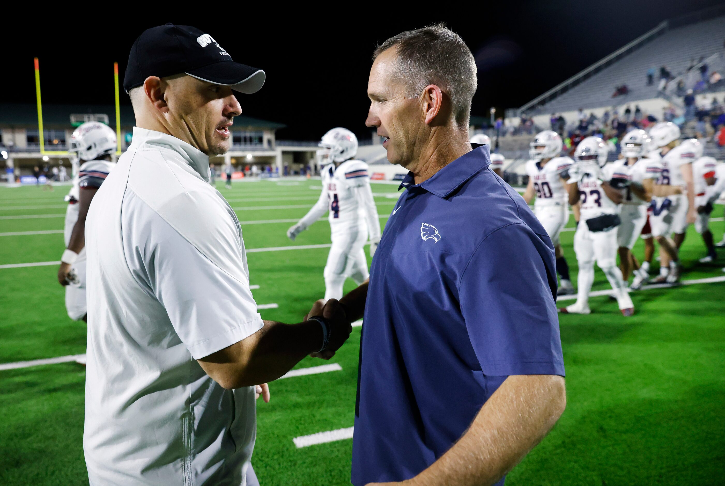 Denton Guyer head coach Reid Heim (left) and Allen head coach Lee Wiginton following their...