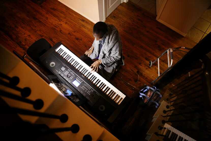 Johnnie Lindsey plays the keyboard at his home in Dallas.