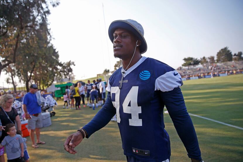 Dallas Cowboys defensive end Randy Gregory walks off the field after afternoon practice at...