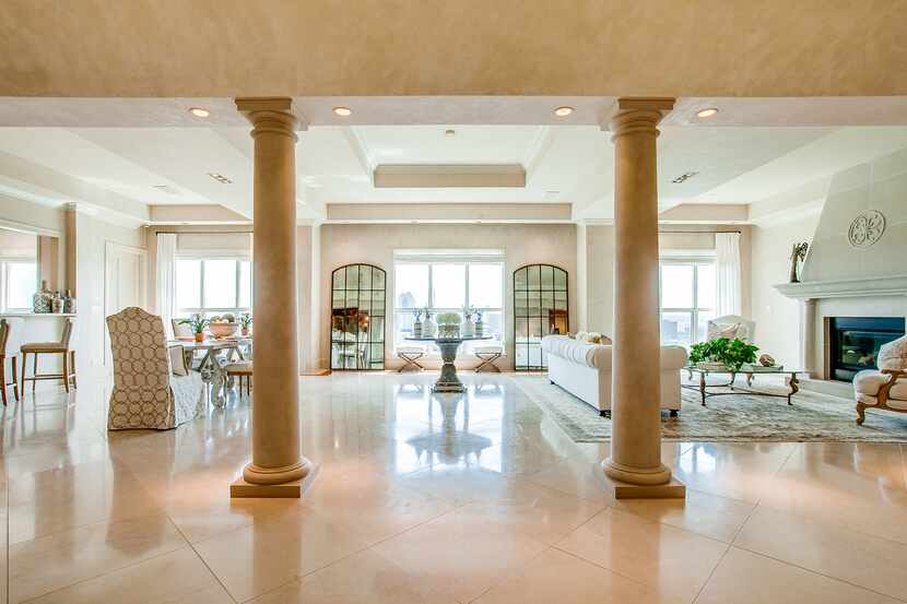 This penthouse in The Mayfair at Turtle Creek and seven others in the Oak...