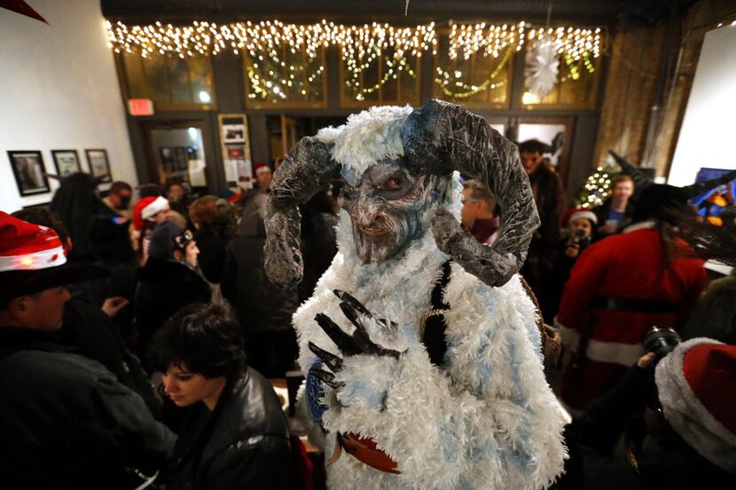 The 3rd Annual Dallas Krampus Walk makes a stop at a Deep Ellum art gallery during the time...