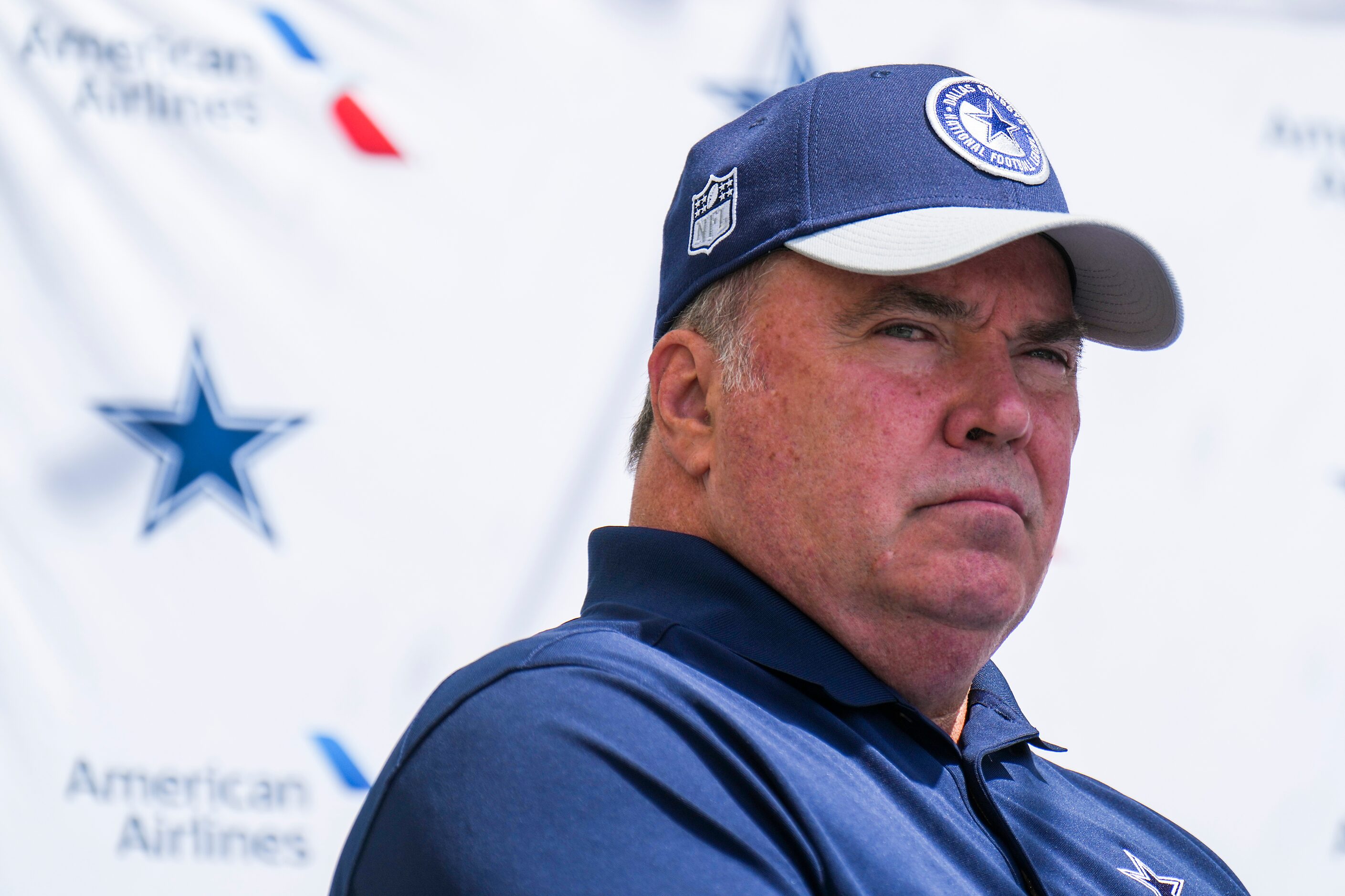 Dallas Cowboys head coach Mike McCarthy listens to a question during pre-training camp news...