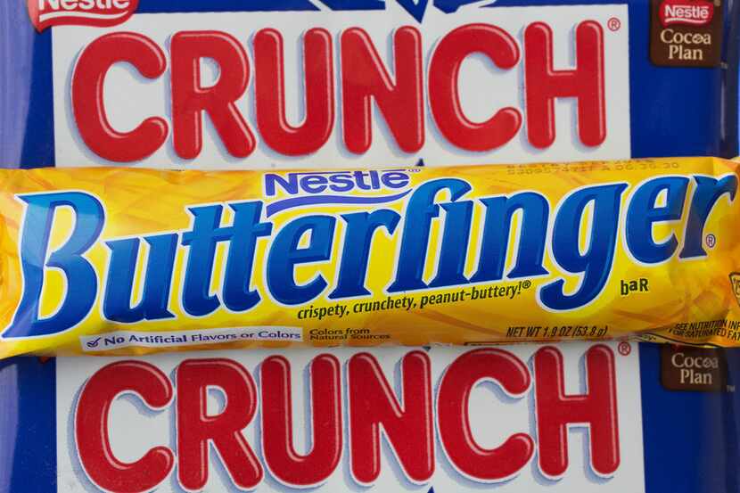 FILE - In this Wednesday, June 1, 2016, file photo, Nestle Butterfinger and Crunch candy...