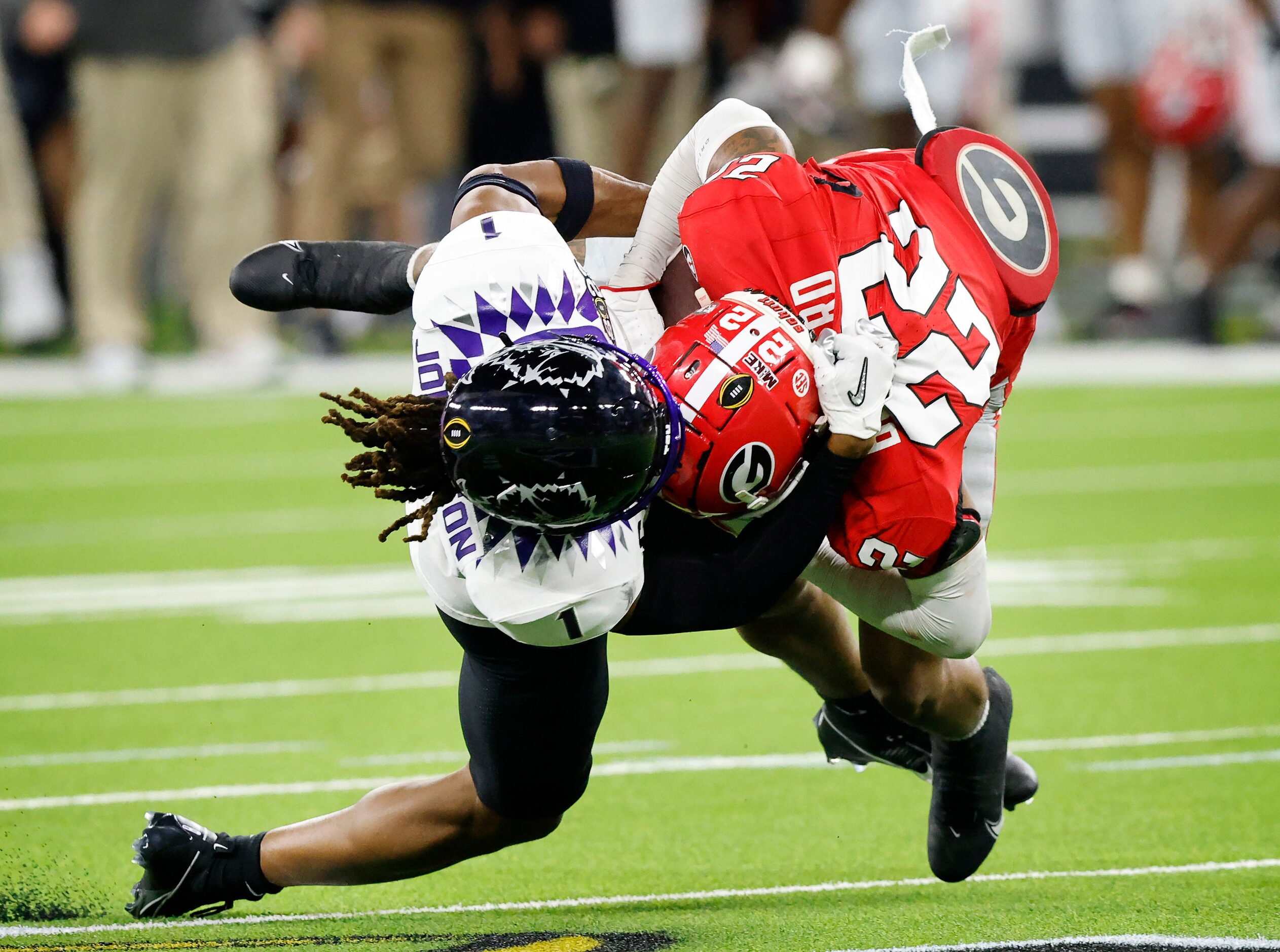 Georgia Bulldogs defensive back Javon Bullard (22) is tackled by TCU Horned Frogs wide...