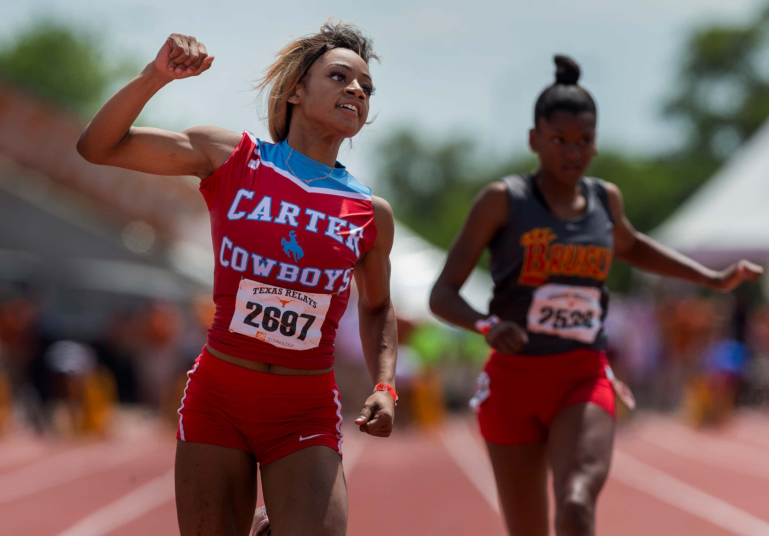 Dallas Carter's Sha'Carri Richardson (2697) finishes first ahead of Brusly's Ta'la Spates...