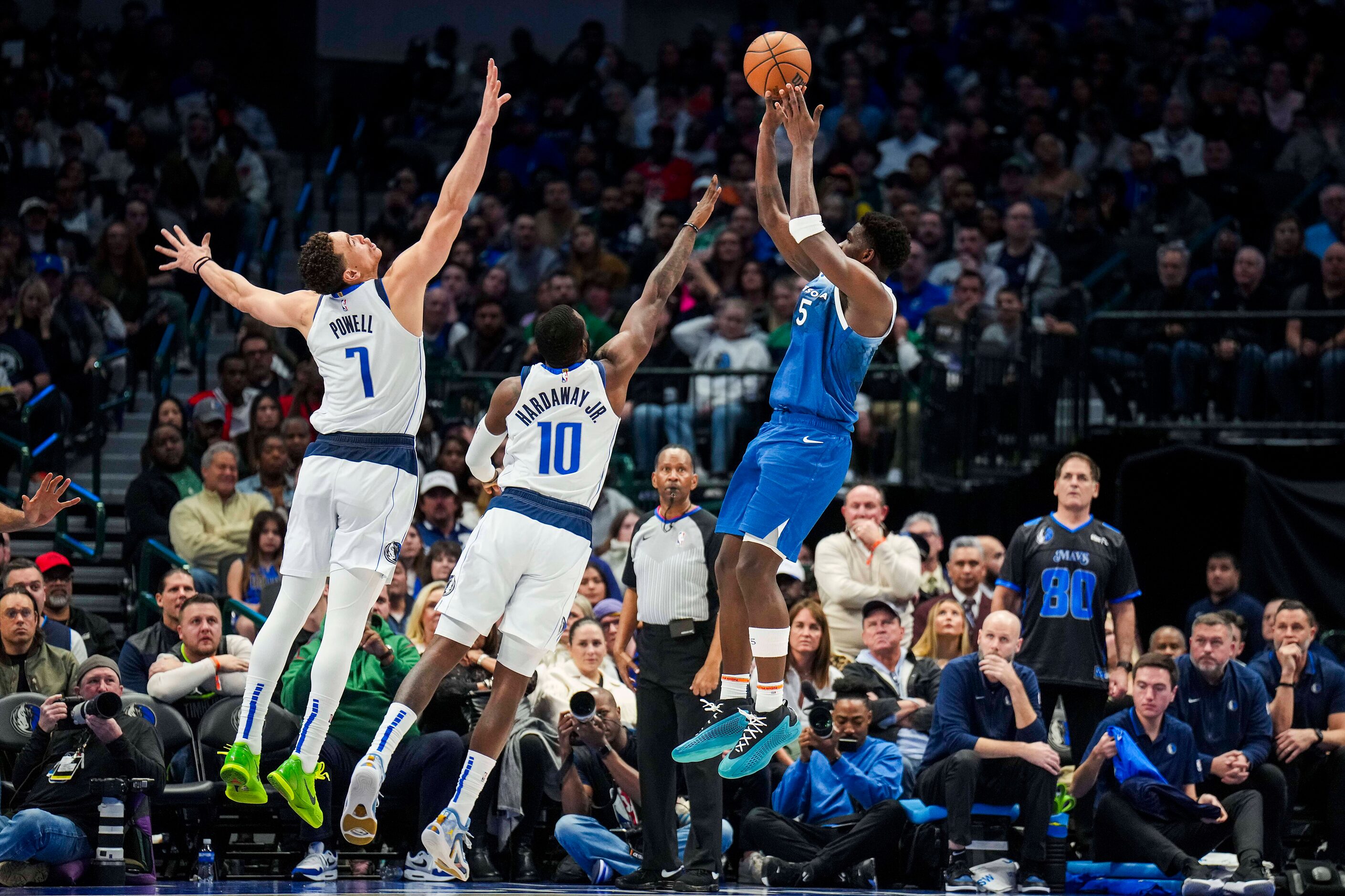 Minnesota Timberwolves guard Anthony Edwards (5) shoots over Dallas Mavericks forward Tim...