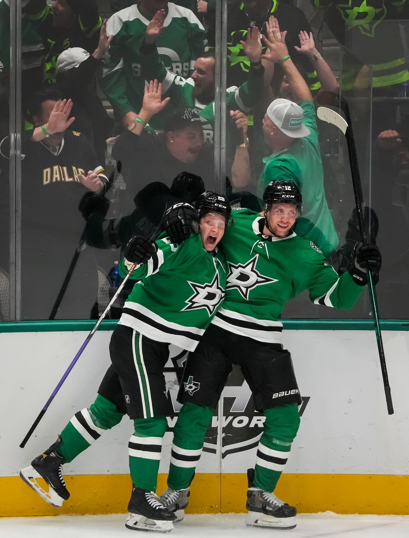 Dallas Stars left wing Joel Kiviranta (left) celebrates with center Radek Faksa after...