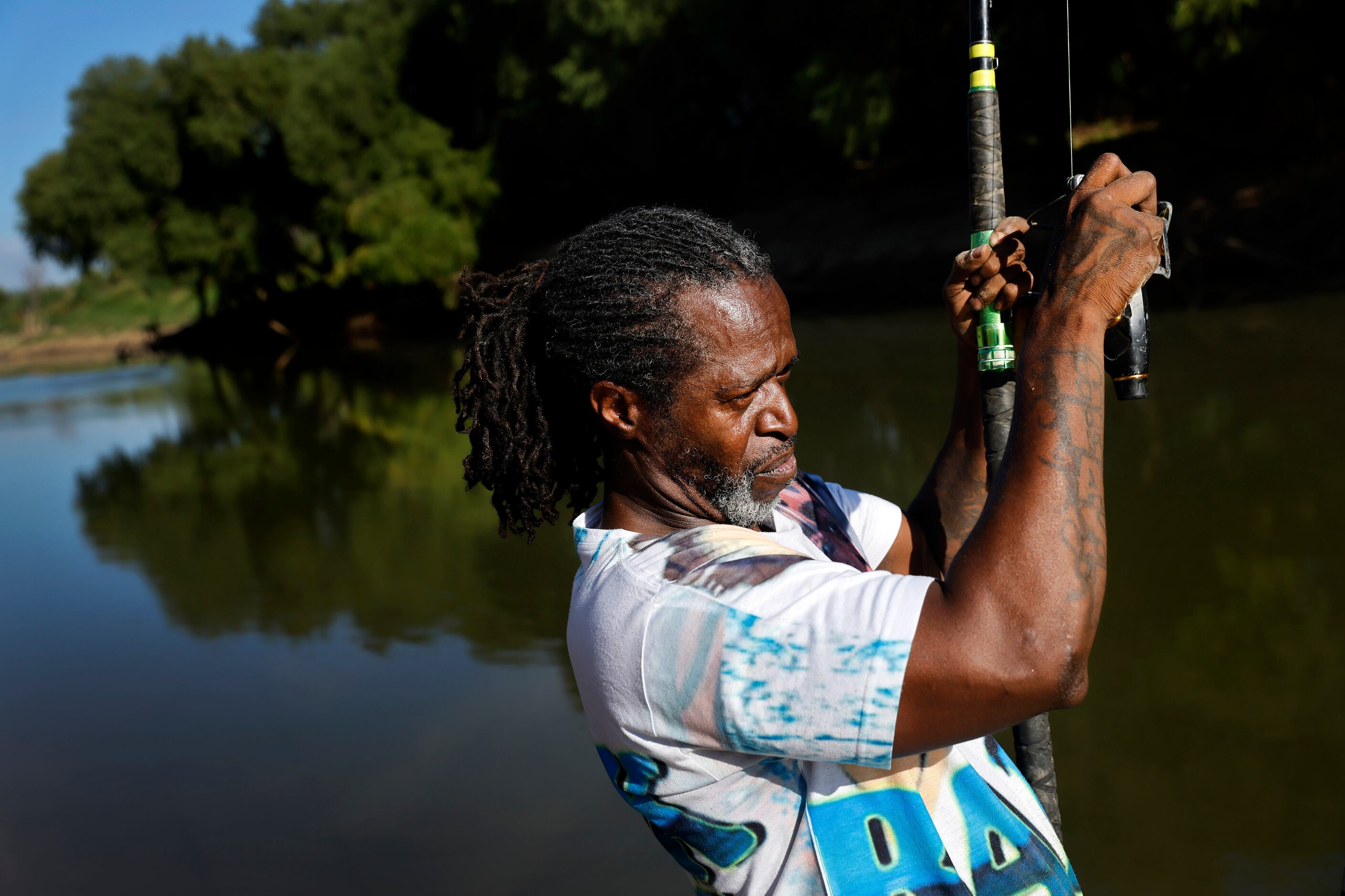 Odell Allen reels in his line to find he caught a softshell turtle instead of an alligator...