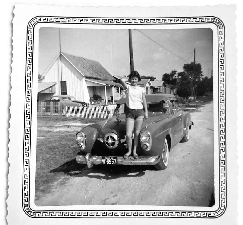 An unidentified young woman stands on an early '50s Studebaker Champion. In the hundreds of...