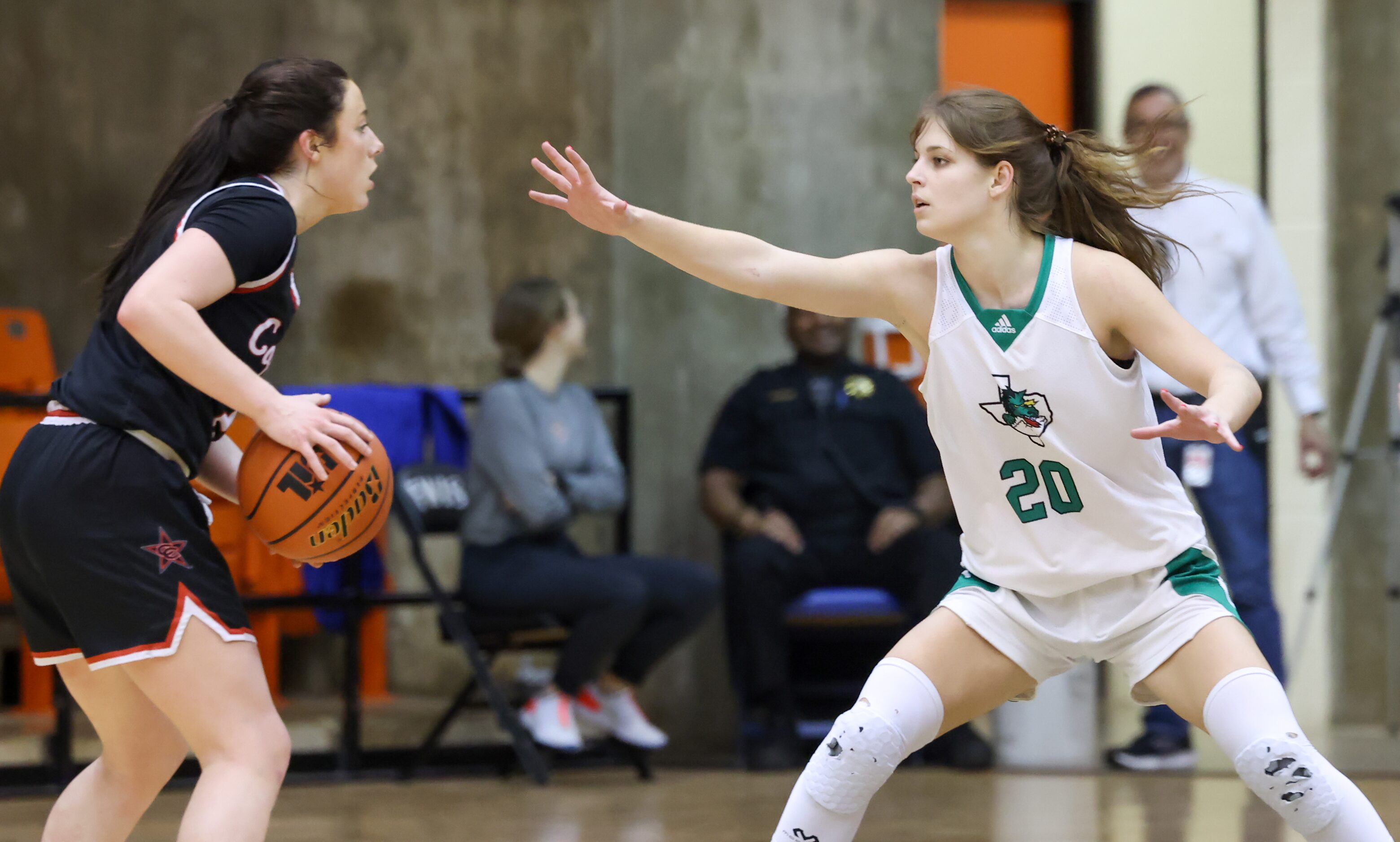 Coppell junior guard Ella Spiller (23) is guarded by Southlake Carroll senior guard Camryn...