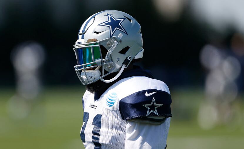 Dallas Cowboys running back Ezekiel Elliott (21) makes his way to the next drill during at...