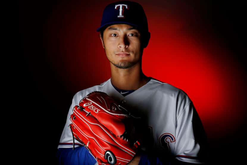  Texas Rangers pitcher Yu Darvish stands for a portrait during the Rangers media day in...