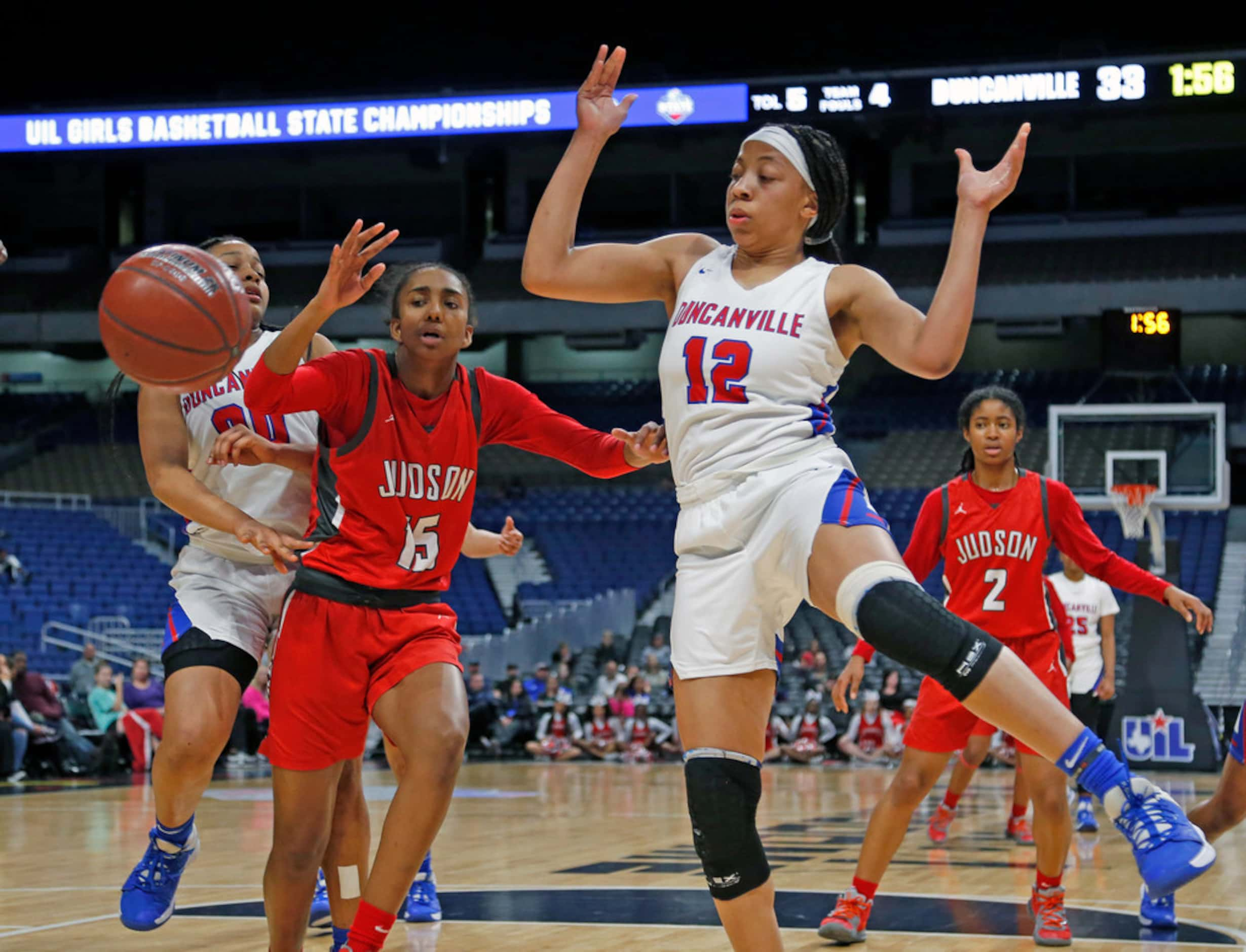 Duncanville center Zaria Rufus #12 battles Judson forward Kierra Sanderlin  #15 for a loose...