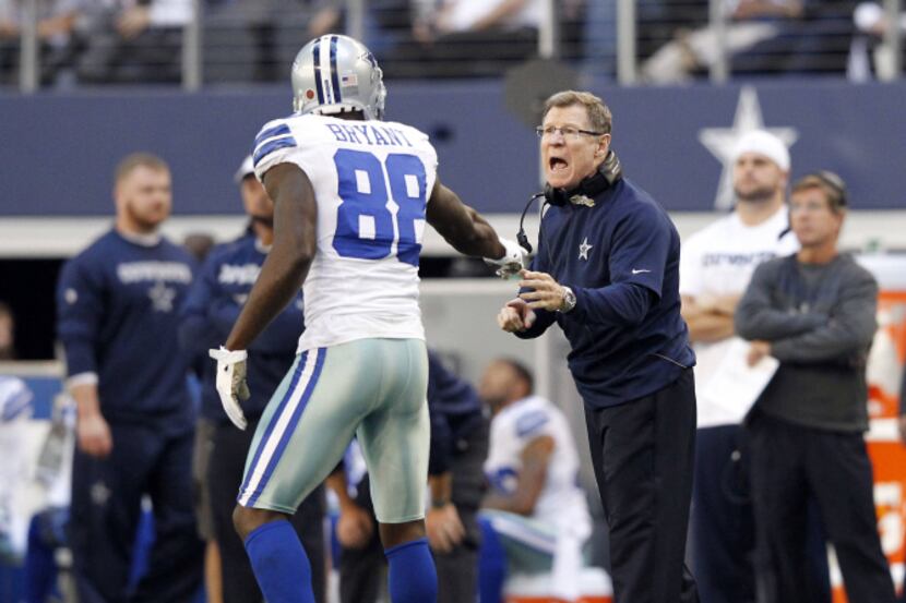 Dallas Cowboys receivers coach Jimmy Robinson talks with Dallas Cowboys wide receiver Dez...