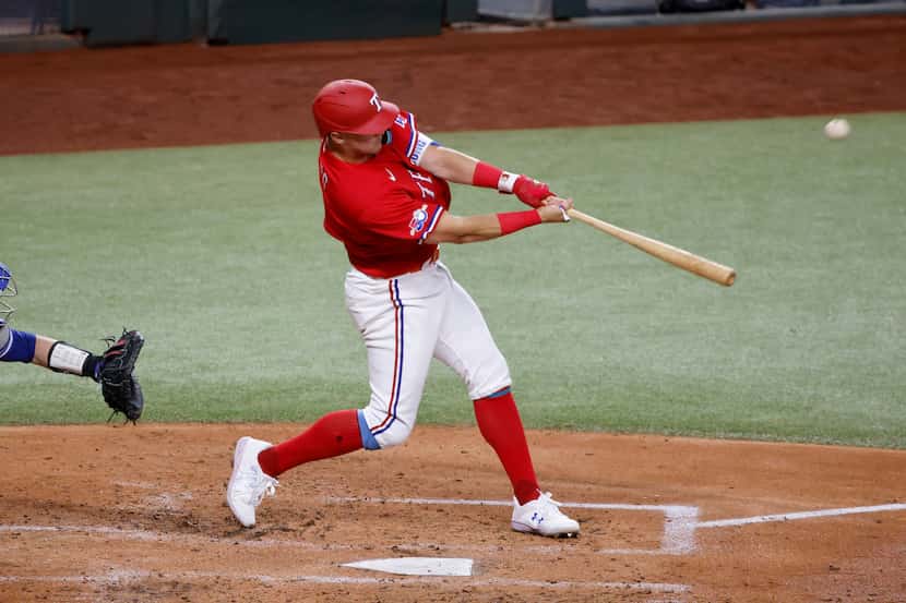 Texas Rangers' Josh Jung hits his first home run on his first major league at-bat, against...