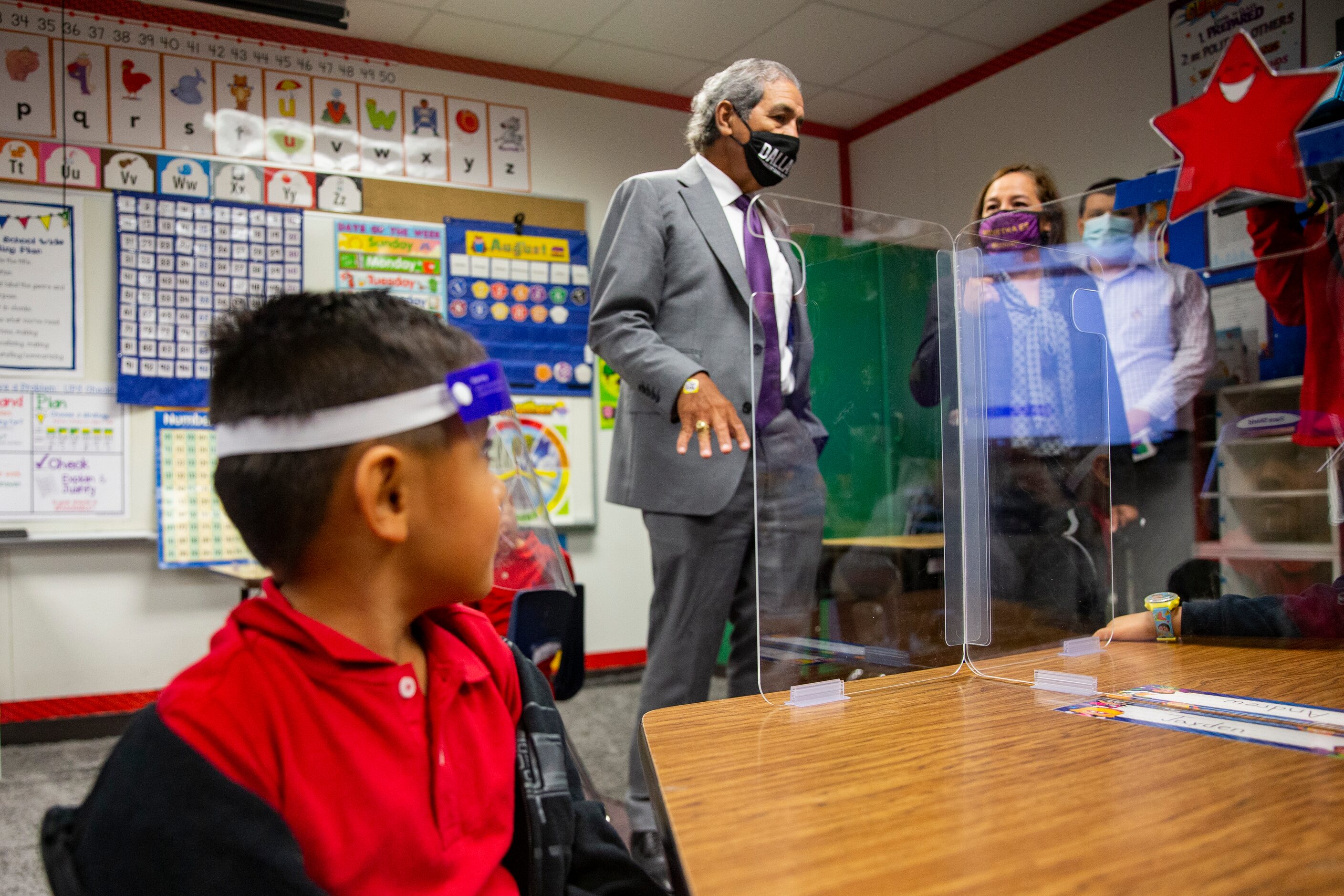 DISD superintendent Michael Hinojosa welcomes students in Ms. Ruiz's kindergarten as they...