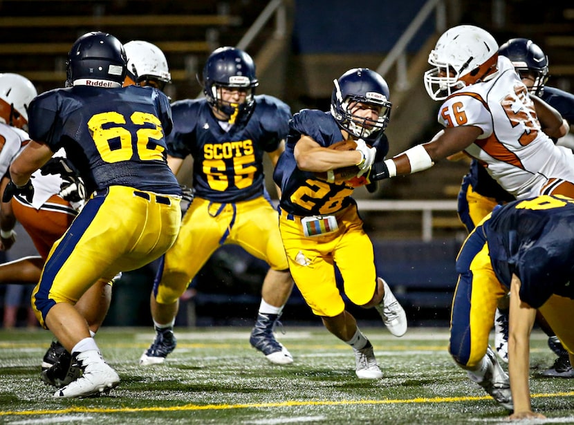 Cole Jackson (28) finds a hole in the West Mesquite line as he rushes during their game...