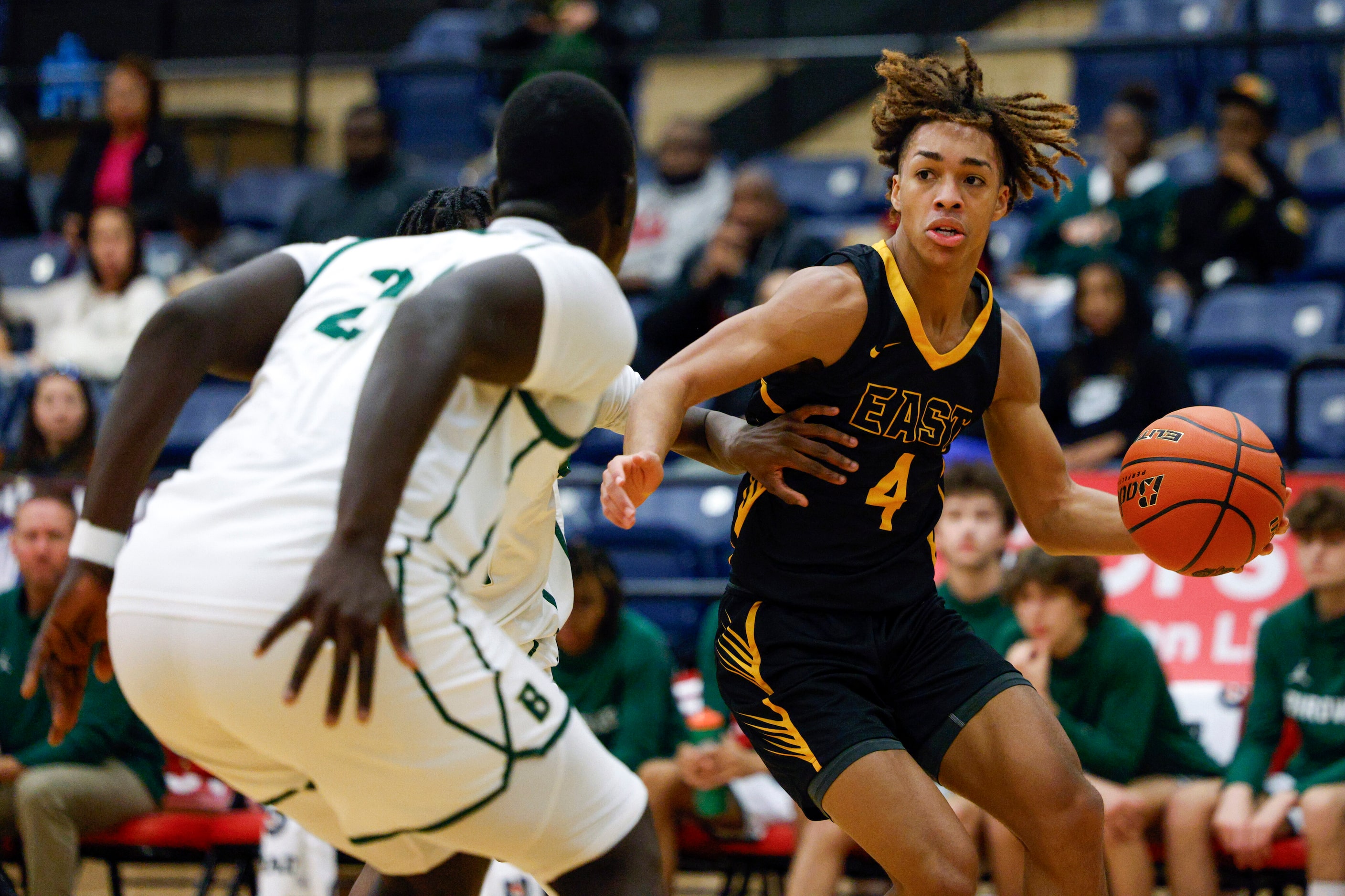 Plano East guard Jordan Mizell (4) dribbles towards the basket against Birdville forward...