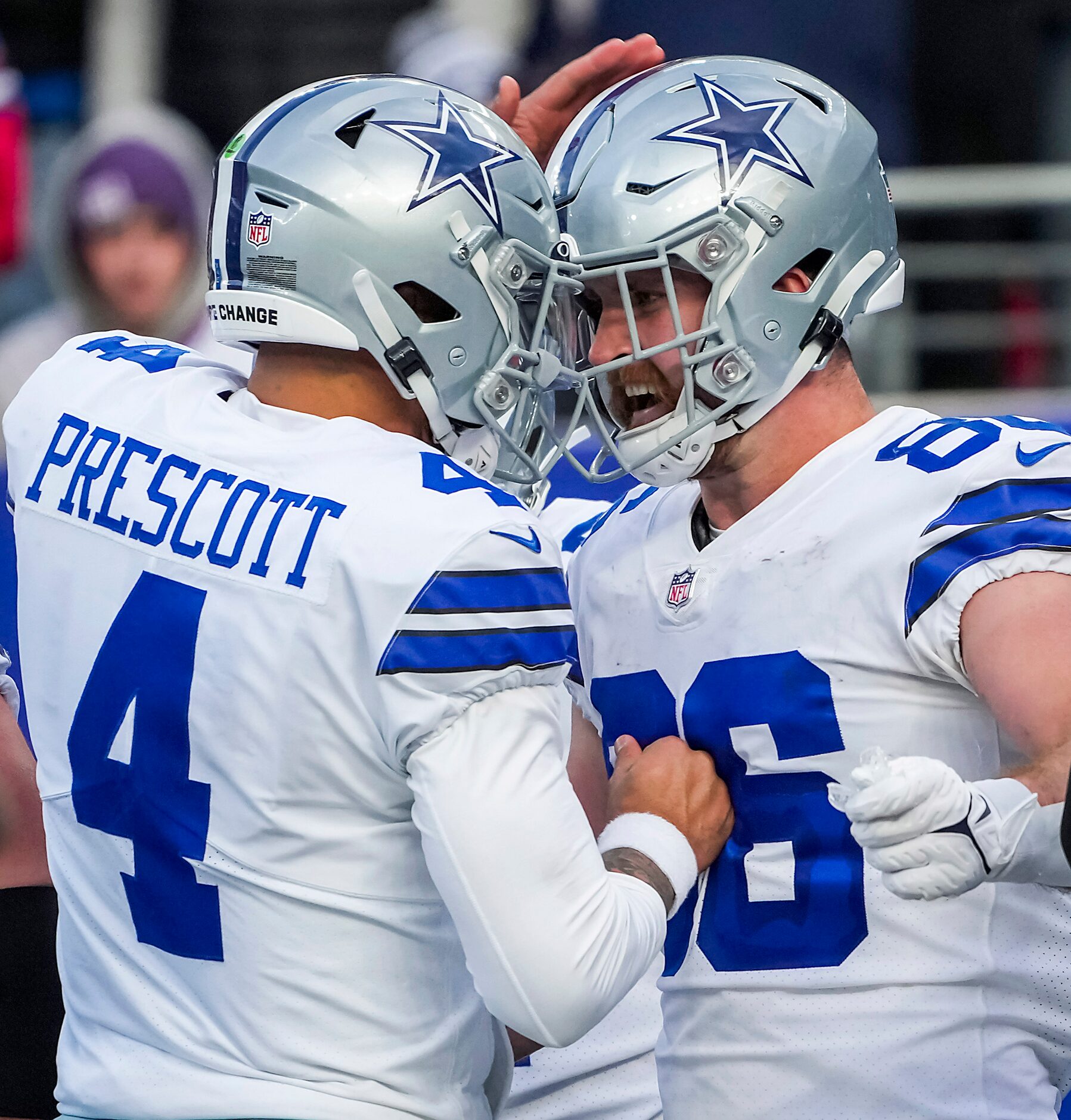 Dallas Cowboys quarterback Dak Prescott (4) celebrates with tight end Dalton Schultz (86)...