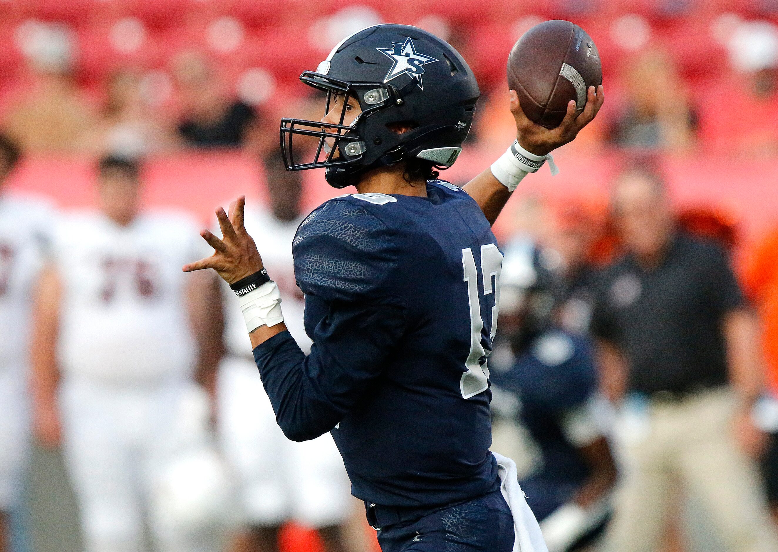 Lone Star High School quarterback Garret Rangel (13) throws a pass during the first half as...