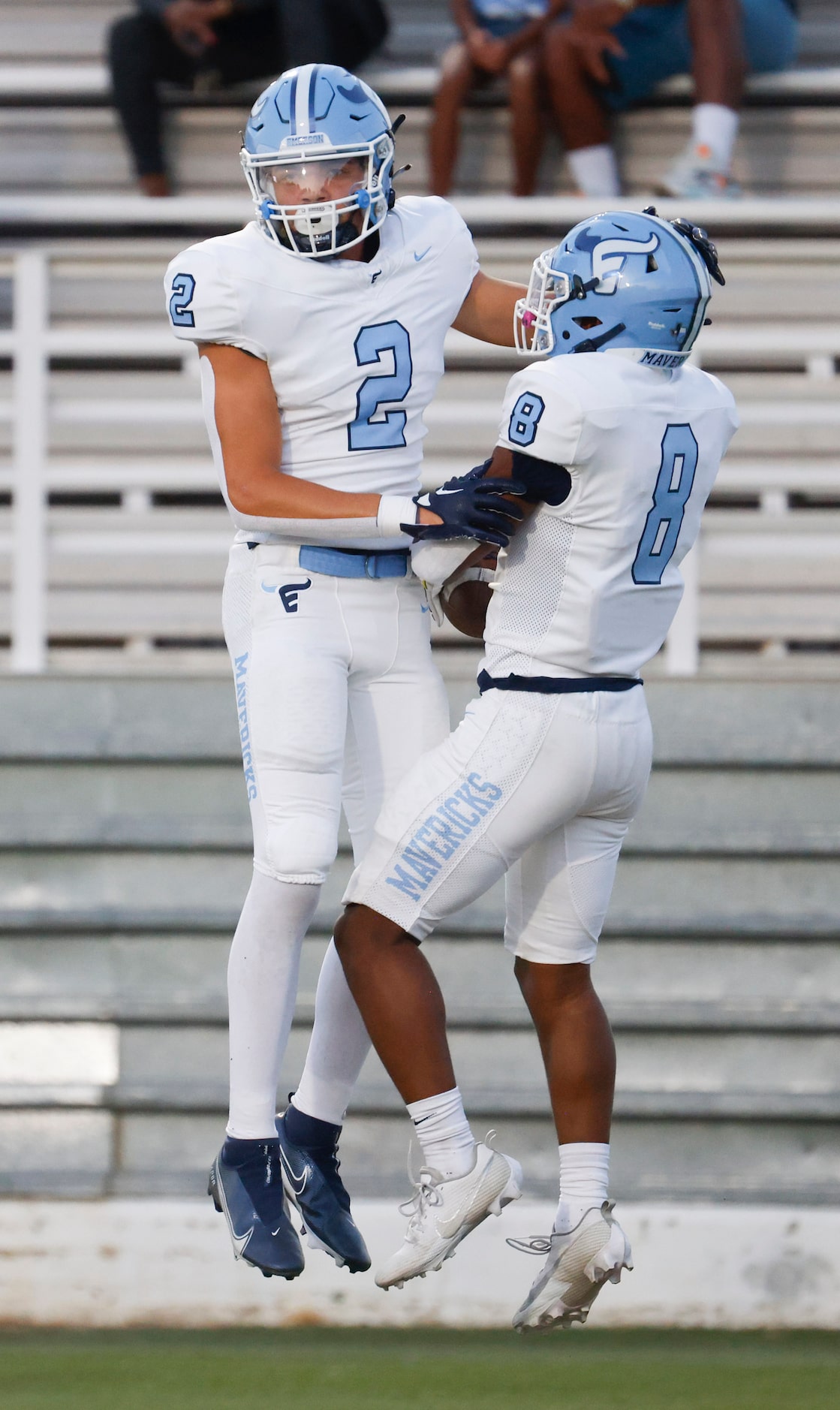 Emerson’s Kylen Evans (2) and Kameron Lockhart (8) cheer after a touchdown during the first...