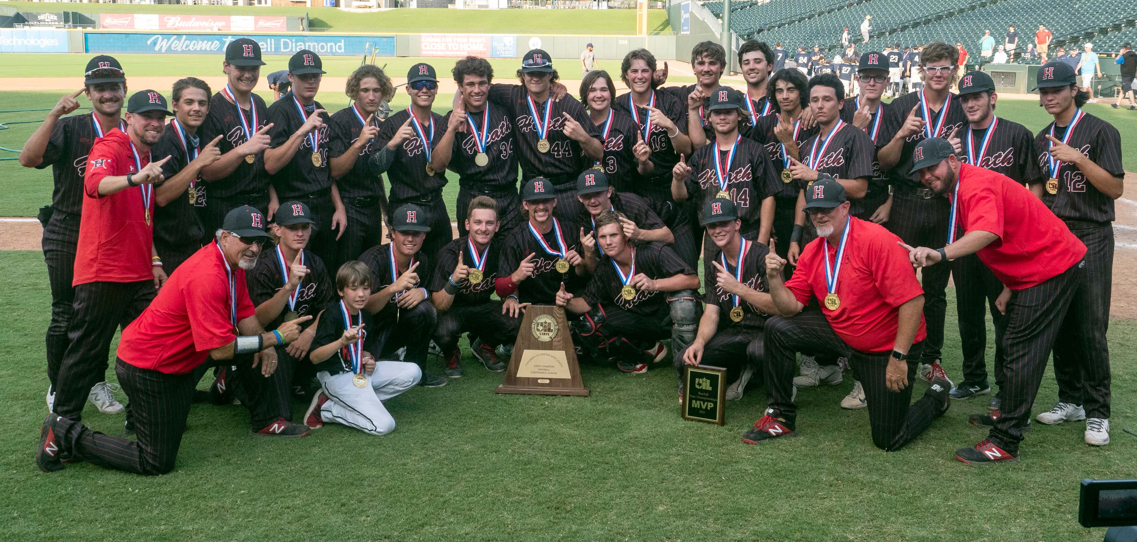 Rockwall-Heath gets a team photo taken with the UIL state trophy after defeating Keller in...