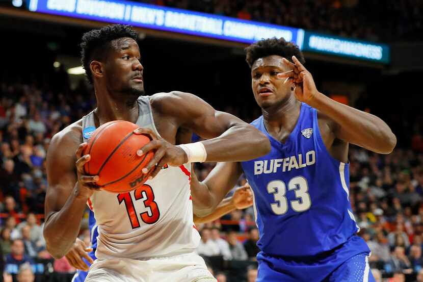 BOISE, ID - MARCH 15:  Deandre Ayton #13 of the Arizona Wildcats handles the ball against...