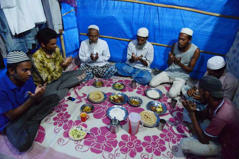 In June, Rohingya Muslim men offered prayers prior to breaking their fast inside their tent...