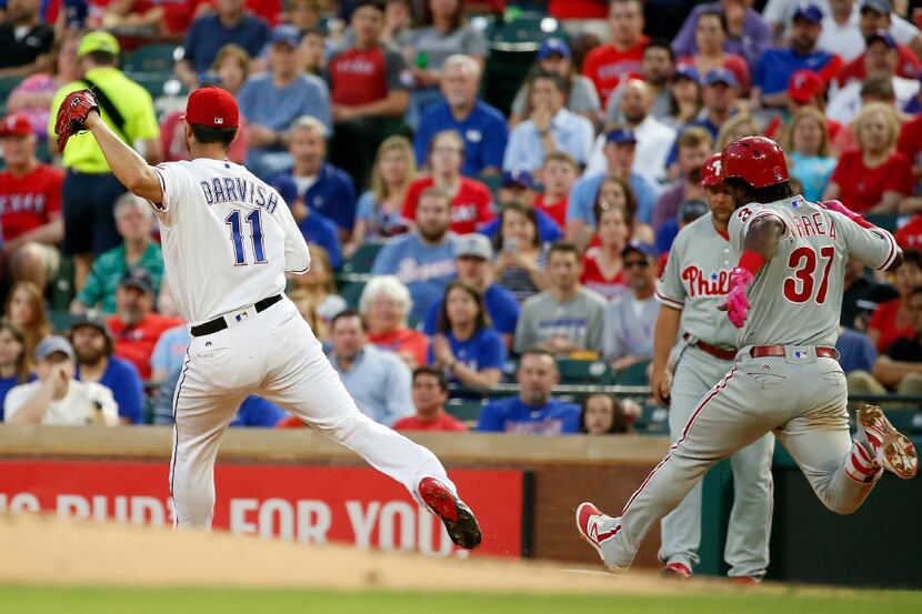 Texas Rangers starting pitcher Yu Darvish (11) forces out Philadelphia Phillies runner...