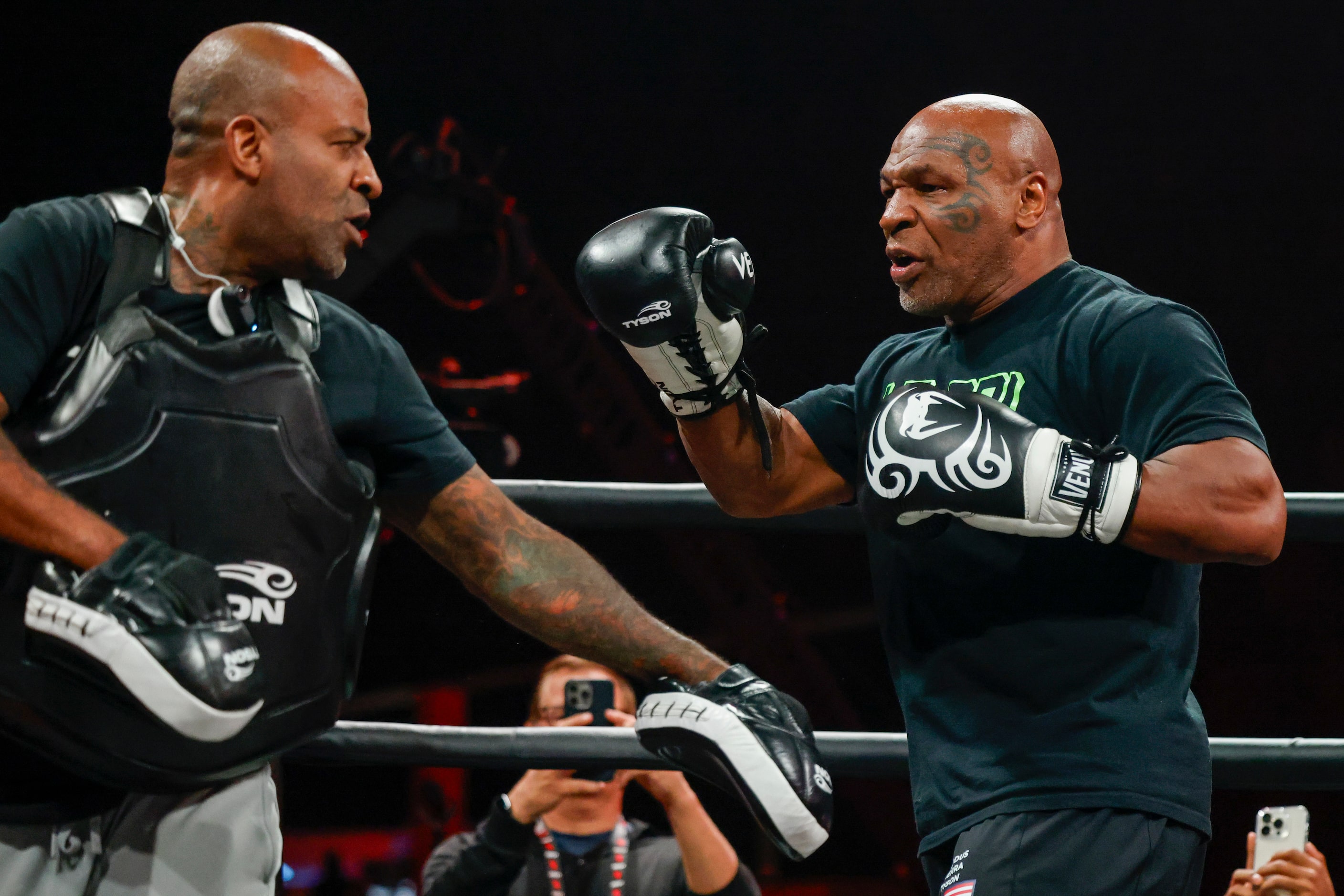 Mike Tyson spars in the ring during an open workout ahead of his upcoming boxing bout...