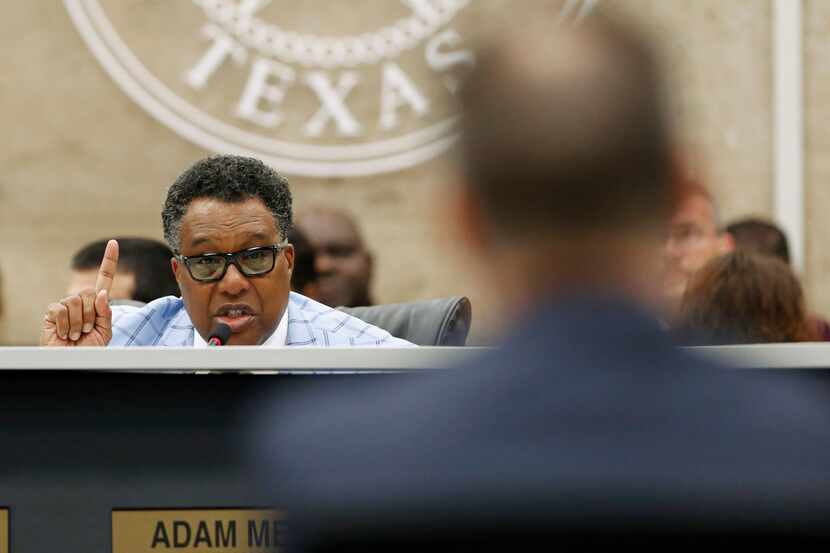 In this April 18, 2018 photo, City Council member Dwaine Caraway asks questions at Dallas...