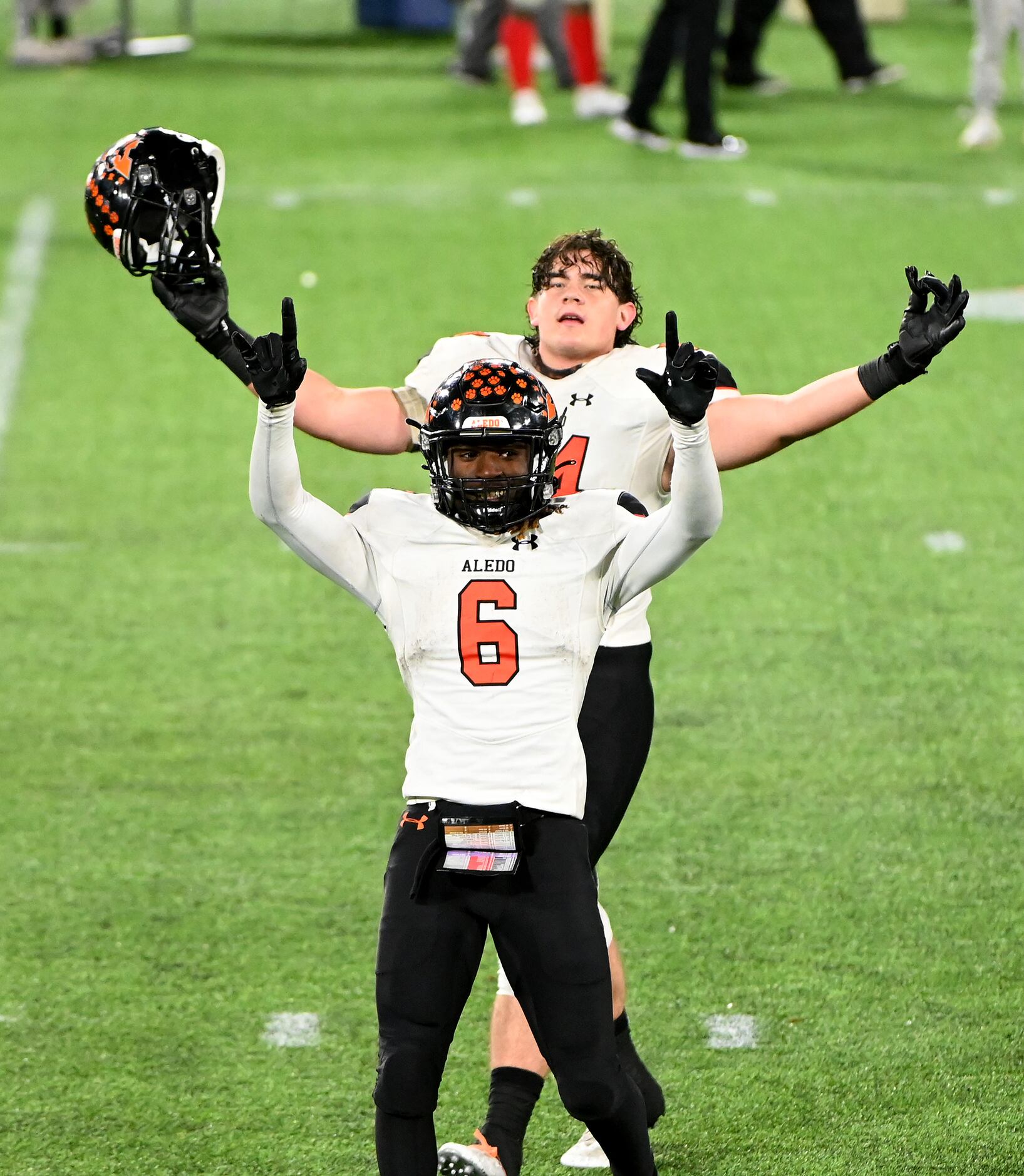Aledo’s Demarco Roberts (6) and Rocco O'Keefe celebrate their 52-48 win of the Class 5A...