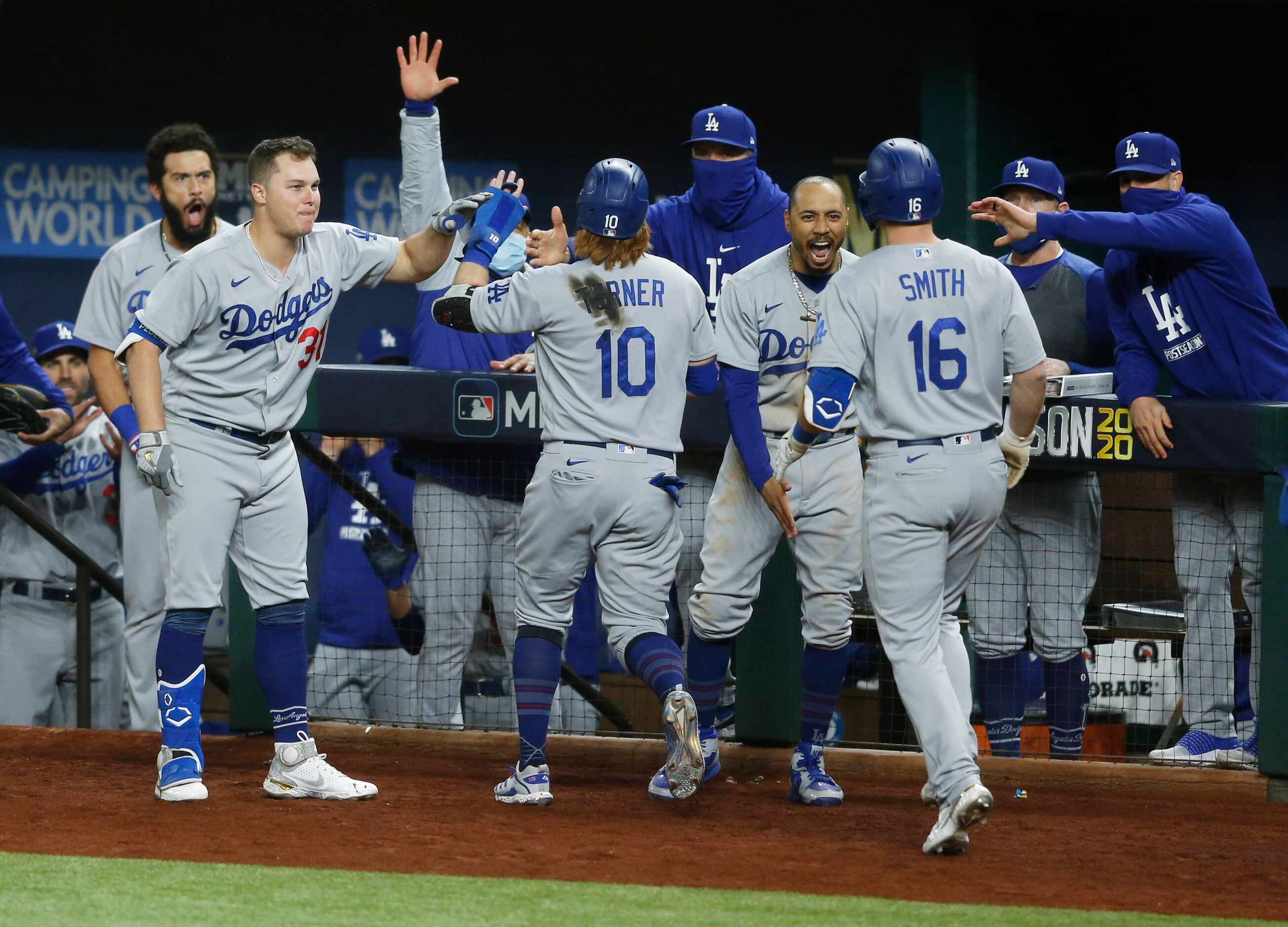 Los Angeles Dodgers catcher Will Smith (16) celebrates with teammates after hitting a three...