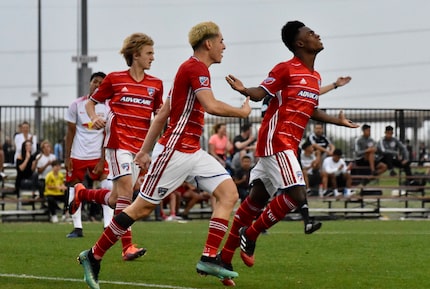 Ronaldo Damus (right) celebrates a goal in the 2018 Dallas Cup against Red Bull Brasil along...