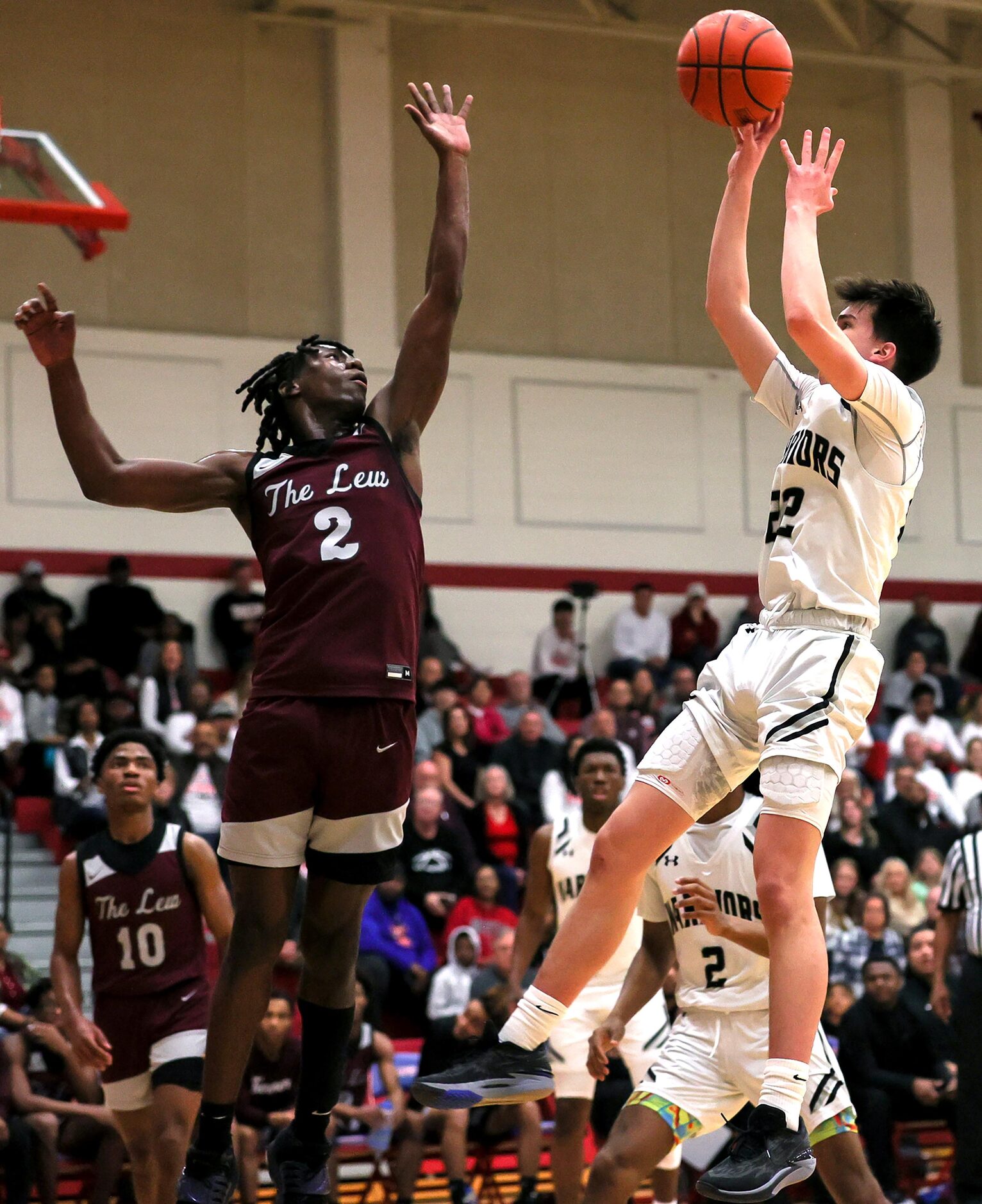 Arlington Martin Jackson Osborn (22) gets off a shot over Lewisville forward Jameer Lewis...