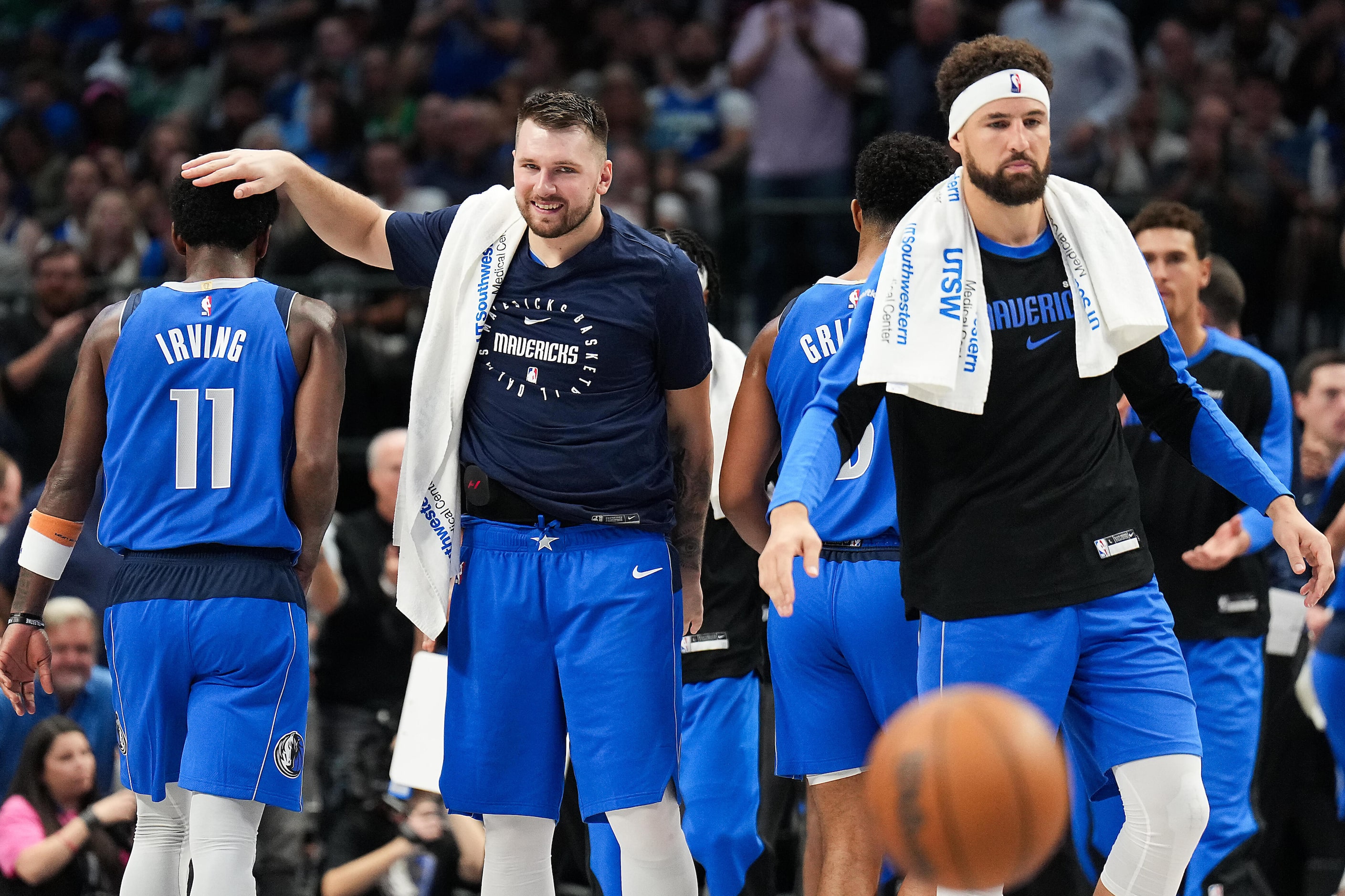 Dallas Mavericks guard Luka Doncic (center) celebrates with Dallas Mavericks guard Kyrie...