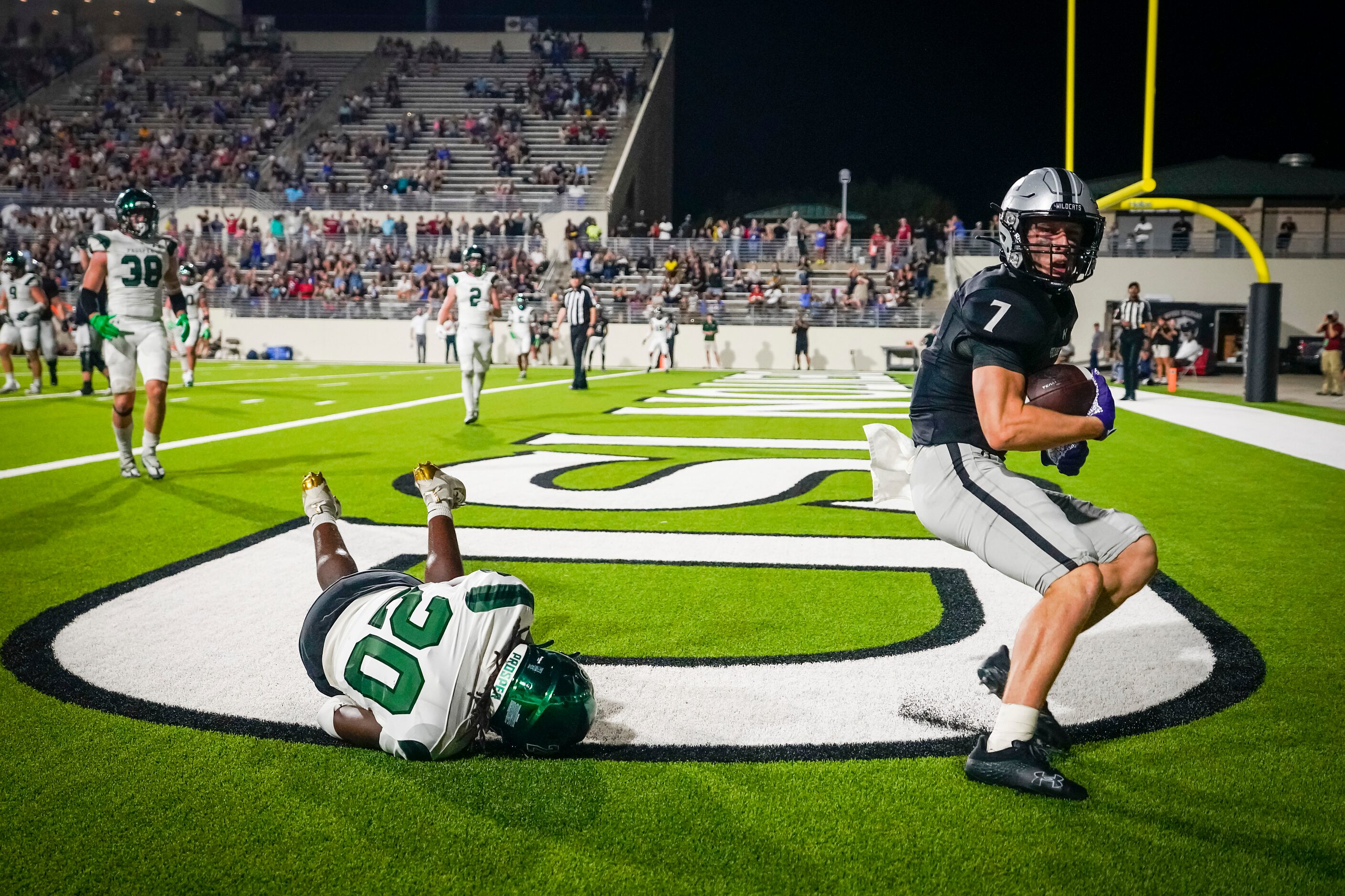 Denton Guyer wide receiver Landon Sides (7) celebrates after scoring on a 7-yard touchdown...