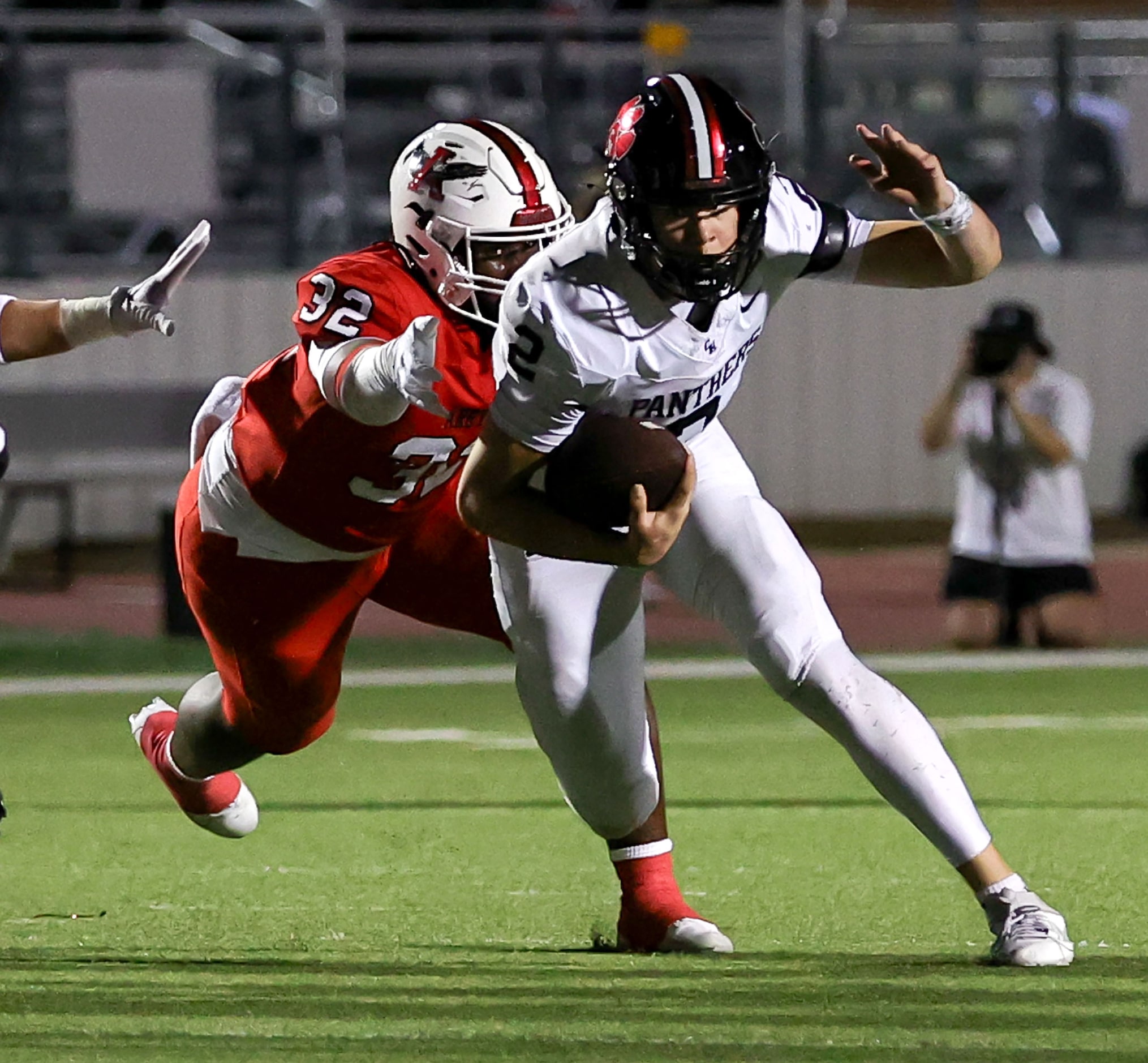 Colleyville Heritage quarterback Bodey Weaver (2) gets pressure by Argyle linebacker Max...