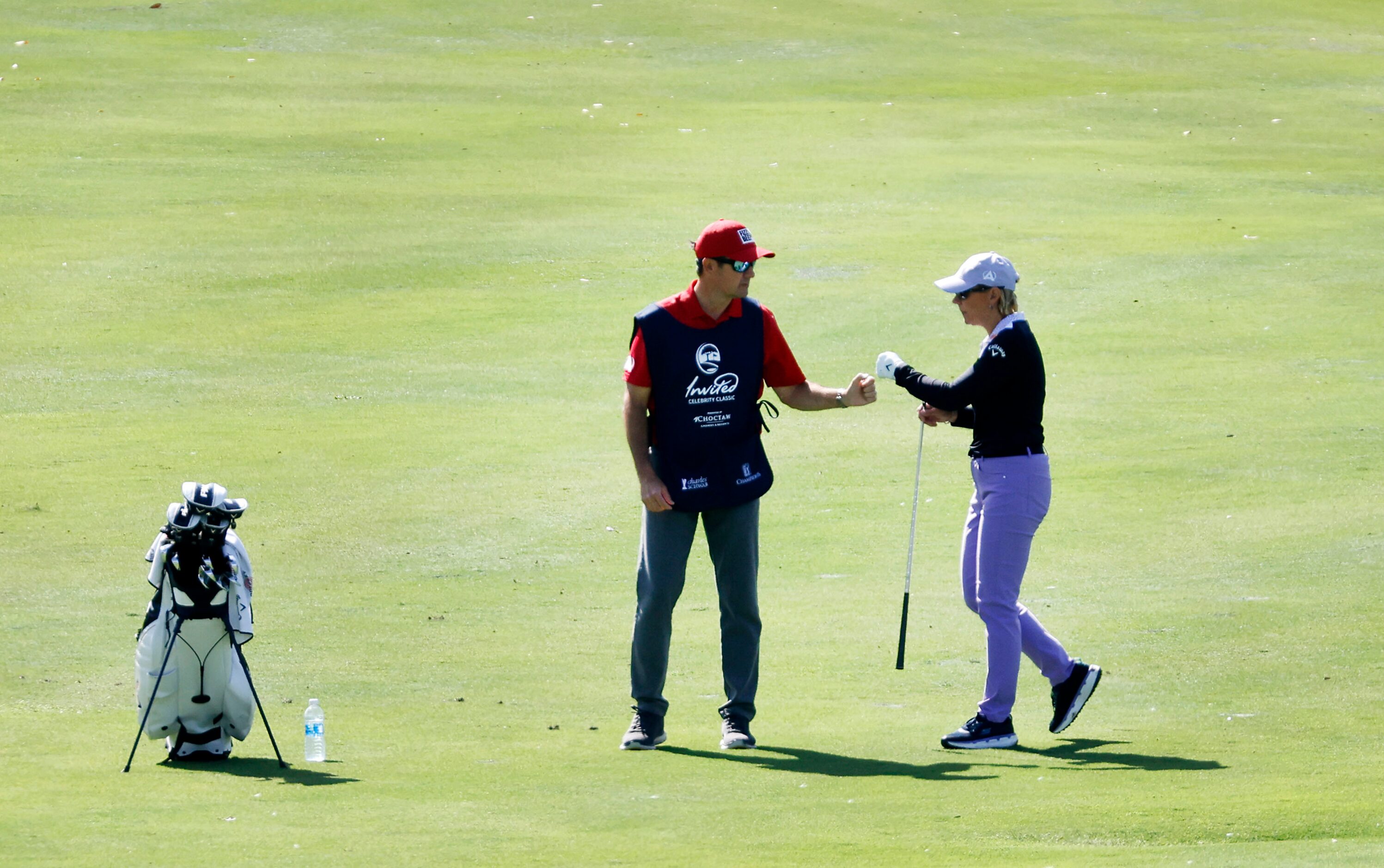 Retired LPGA golfer Annika Sorenstam (right) receives a fist bump from her husband and...