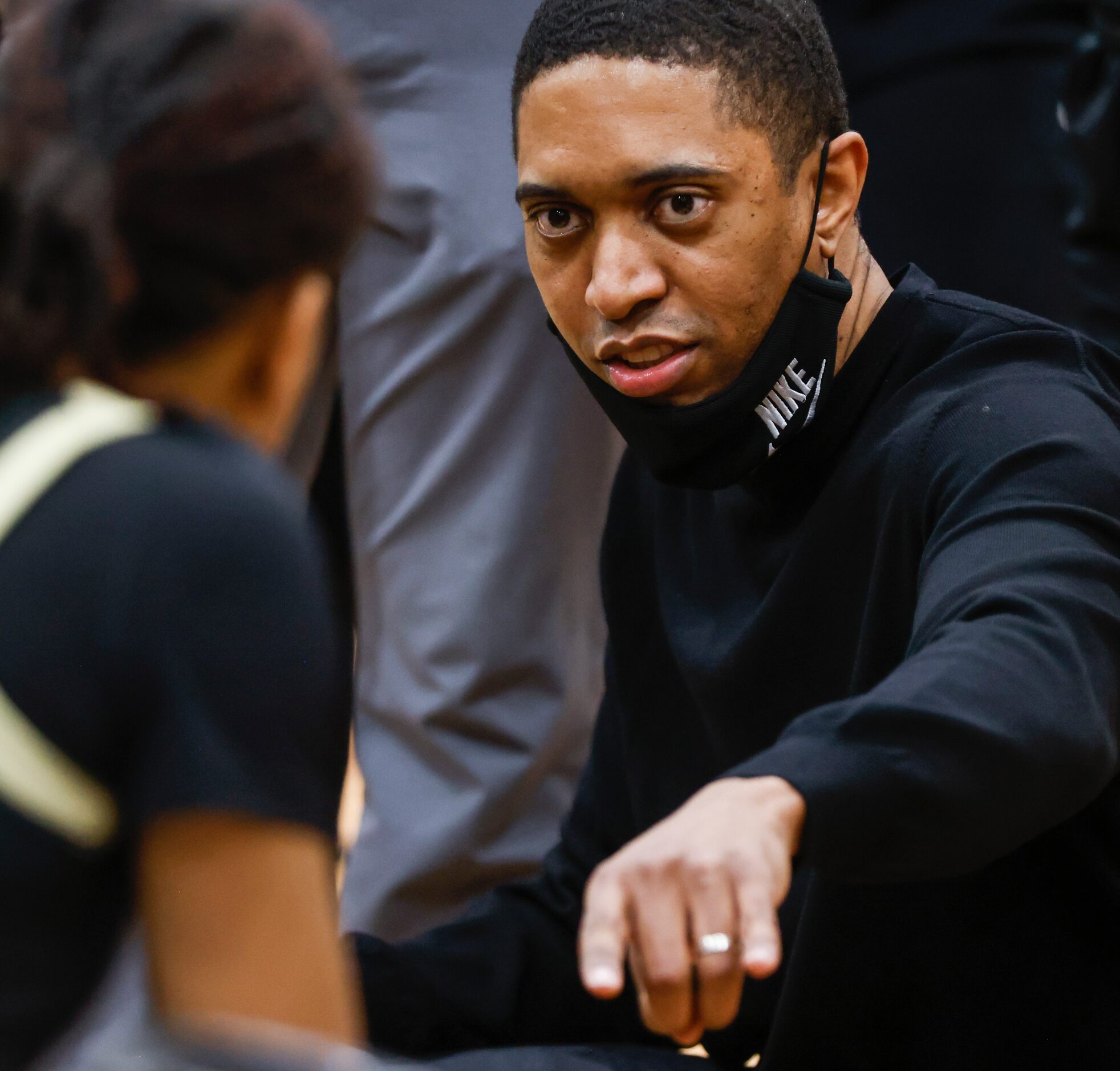 South Grand Prairie High School head coach Brion Raven talks to a South Grand Prairie High...