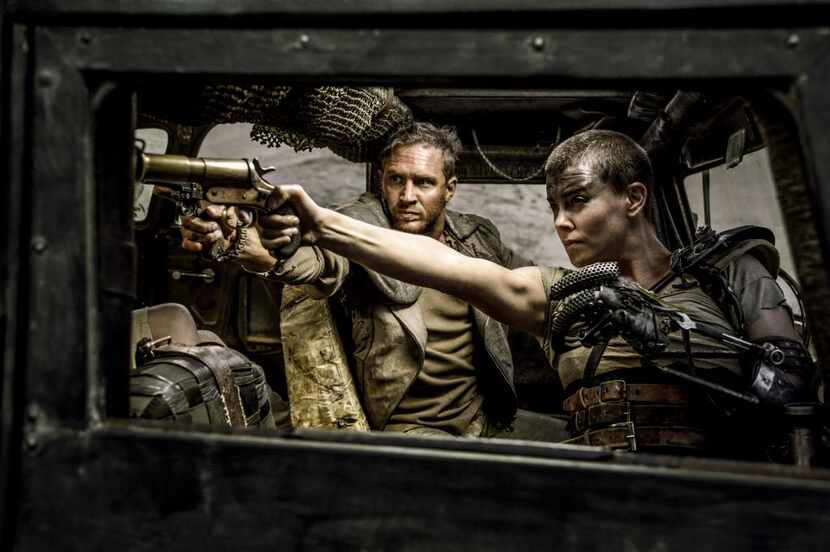 Charlize Theron, right, as Imperator Furiosa in “Mad Max:Fury Road."